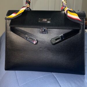 Black Structured Handbag with Colorful Scarf Accents